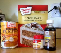 cake ingredients are sitting on the counter next to a can of pumpkin spice and an orange juice