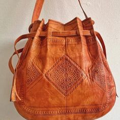 An amazing tan leather boho bag is the best addition to your bohemians bags collection.A stunning piece from our dazzling collection of authentic and stylish Leather crossbody hippie bags crafted in Marrakesh. Handmade and carved, functional, and perfect for office or weekends .Leather with a Boho pattern enhances the rich textural quality of a small bohemian bag crafted from soft leather . - 100% leather- 100% handmade- Long durabilityDimensions : 36 × 34 × 10 cm (H * L * W)Shipping & Delivery Bohemian Brown Hobo Bag, Traditional Brown Hobo Bag With Adjustable Strap, Bohemian Crossbody Bucket Bag For Festivals, Bohemian Leather Shoulder Bag For Daily Use, Bohemian Leather Tote Satchel, Bohemian Festival Crossbody Bucket Bag, Bohemian Brown Satchel With Adjustable Strap, Bohemian Satchel Bucket Bag For Festivals, Bohemian Soft Leather Crossbody Bag