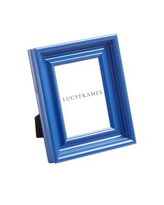 a blue frame sitting on top of a white wall next to a black object with the word lucgyframes written in it