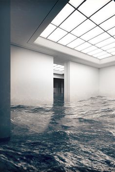 an empty room with water covering the floor