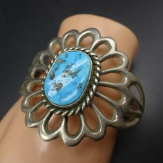 "VINTAGE NAVAJO BRACELET DESCRIPTION: With a gorgeous cab of blue Kingman turquoise, this classic sand cast bracelet will be a cherished addition to your collection of fine vintage Native American jewelry. MEASUREMENTS: Interior of the cuff measures 5 3/4\" with an additional 1 1/4\" slightly adjustable gap. Total circumference: 7\" Measures 2 1/2\" straight across the widest part (from wrist bone to wrist bone) Bracelet face measures 2 1/8\" wide (the face of the bracelet, north to south) Caboc Southwestern Style Stamped Blue Bracelets, Vintage Turquoise Stamped Bracelets, Vintage Stamped Blue Jewelry, Blue Vintage Stamped Jewelry, Vintage Stamped Turquoise Jewelry, Vintage Turquoise Stamped Jewelry, Vintage Turquoise Stamped Cuff Bracelet, Adjustable Turquoise Vintage Cuff Bracelet, Adjustable Vintage Turquoise Cuff Bracelet