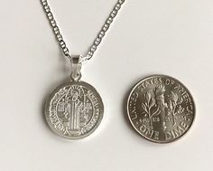 "925 STERLING SILVER SAINT BENEDICT NECKLACE 18\" LONG... FOR GOOD LUCK ,PROSPERITY AND PROTECTION. MADE IN ITALY-BEST QUALITY PENDANT : 22 X 15mm CADENA DE SAN BENITO EN 925 PLATA ESTERLINA 18\" LARGO .. PARA PROSPERIDAD, BUENA SUERTE Y PROTECCION. HECHO EN ITALIA-MEJOR CALIDAD DIJE: 22 X 15mm" Silver Charm Necklace With Round Pendant Stamped 925, Silver Round Pendant Charm Necklace Stamped 925, Silver Charm Necklace With 925 Stamp And Round Pendant, Silver Charm Necklace With Round Pendant, Sterling Silver Charm Necklace With Stamped 925 Round Pendant, Sterling Silver Charm Necklaces With Stamped 925 Round Pendant, Sterling Silver Round Pendant Charm Necklace Stamped 925, Sterling Silver Stamped 925 Round Pendant Charm Necklace, Sterling Silver Charm Necklace With Round Pendant