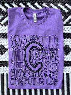 Computer Lab Shirt || Teacher || School Shirts This listing is for the Computer Lab design but -- there are so many other designs -- TK, Educator, Paraprofessional, SpEd, Coach, Custodian, School Nurse, Principal, Assistant Principal etc.  Pictured: Heather Team Purple  Check the pictures for shirt color options! Made on unisex Bella + Canvas shirts.  Personalization: Add note for shirt color and design! Casual Cotton Shirt With Printing, Cotton Graphic Design Crew Neck Shirt, Graphic Design Cotton Crew Neck Shirt, Crew Neck Cotton Shirt With Graphic Design, Cotton Crew Neck Shirt With Graphic Design, Purple Cotton Graphic Tee Shirt, Trendy Purple Shirt With Graphic Print, Purple Cotton Tops With Graphic Design, Purple Graphic Tee With Screen Print