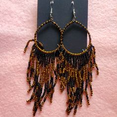 Pretty Gold Black Seed Bead Earrings On Fish Hooks Black Beaded Hoop Earrings For Party, Black Hoop Earrings With Colorful Beads As Gift, Black Hoop Earrings With Colorful Beads For Gift, Gift Black Hoop Earrings With Colorful Beads, Adjustable Black Hoop Earrings With Colorful Beads, Bohemian Black Hoop Earrings With Dangling Beads, Party Black Beaded Round Earrings, Bohemian Black Dangle Beads, Black Beaded Earrings With Ear Wire For Festival