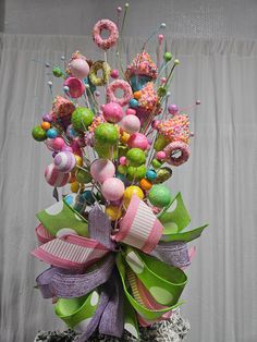 a vase filled with lots of different colored decorations