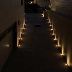 some lights that are on the side of a building