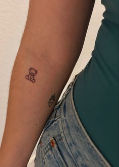 a person with a small tattoo on their arm