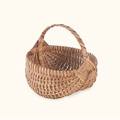 a wicker basket is shown on a white background