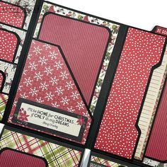 the inside of a christmas scrapbook with red and green plaid designs on it, including snowflakes