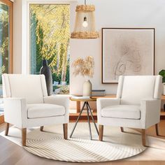 a living room with two white chairs and a round rug in front of a window