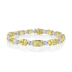 Experience the elegance of our mixed shape, fancy yellow and white diamond riviera bracelet, featuring asscher, emerald, heart, oval, pear, and radiant diamonds. Yellow Diamond Bracelet, Ascher Cut, Diamonds Direct, Fancy Yellow Diamond, Radiant Diamond, Tennis Bracelet Diamond, Yellow Diamond, Tennis Bracelet, White Diamond