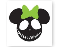 a black and green skull with a bow on it's head is shown in front of a white background