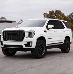 a white truck parked in a parking lot