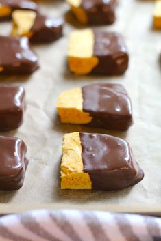 chocolate and peanut butter squares on a baking sheet