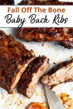 baby back ribs with bbq sauce on the side and text overlay that reads fall off the bone baby back ribs