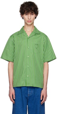 Organic cotton poplin shirt. Stripes and topstitching throughout. · Open spread collar · Button closure · Hand-stitched logo graphic at patch pocket · Vented side seams · Contrast stitching in black Part of the High Summer collection. Supplier color: Millet Green Collared Tops With Welt Pockets, Green Cotton Shirt With Lapel Collar, Green Relaxed Fit Shirt With Patch Pockets, Designer Cotton Button-up Tops, Green Shirt With Patch Pockets And Relaxed Fit, Designer Cotton Button-up Shirt, Casual Cotton Shirt With Contrast Stitching, Designer Green Cotton Shirt, Green Work Shirt With Patch Pockets