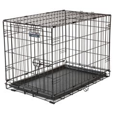 a dog crate with the door open and one side opened to show it's tray