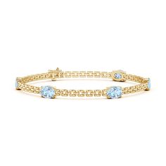 Stack it or wear it solo, this five stone station link bracelet is sure to grab attention. It is designed in 14k yellow gold and features oval sea-blue aquamarines that are horizontally aligned. Tanzanite Bracelet, April Birthstone Jewelry, Aquamarine Bracelet, March Birthstone Jewelry, Aqua Marine, Aquamarine Blue, Natural Aquamarine, March Birth Stone, Birthstone Jewelry