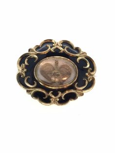 Victorian mourning hair memento glassed brooch pin C clasp enamel in very good condition considering its age measuring 5cm x 4cm All pieces are unique I aim to provide you with a 5 star service and 100% customer satisfaction is my priority. All my items are vintage and pre owned so at times they will have signs of age but I try my very best to describe them with accuracy. If you are not happy with your purchase for any reason. Please contact me immediately and you can return the item. Your purchase will be carefully packed to protect it. If you wish it wrapped as a gift for someone then do let me know please. SHIPPING U.K.POSTAGE: FREE SHIPPING  Royal Mail Special delivery INTERNATIONAL SHIPPING  FREE SHIPPING WORLDWIDE  ROYAL MAIL I SHIP TRACKED SIGNED AND INSURED BUT IT DOES NOT COVER CU Victorian Gold Brooch With Locket, Victorian Gold Locket Brooches, Antique Style Enamel Brooch Pin For Formal Wear, Victorian Style Formal Enamel Brooch Pin, Victorian Engraved Medallion Brooches, Antique Engraved Collectible Brooches, Antique Engraved Medallion Brooches, Antique Gold Intaglio Brooches, Victorian Locket Brooch For Formal Occasions