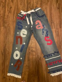 a pair of jeans that have been decorated with the american flag