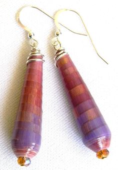 pair of purple and red earrings on white background