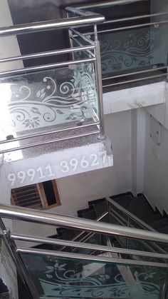 an overhead view of some stairs and railings with the number 8989 on it