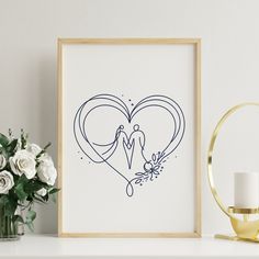 a frame with a drawing of a man and woman in the shape of a heart