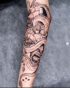 a woman's arm with tattoos on it and an image of a demon in the background