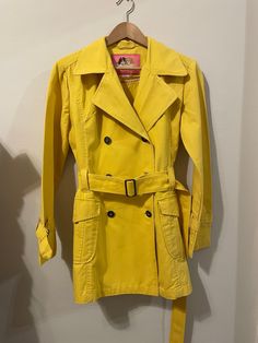 1980s Fiorucci trench coat in yellow. Size Medium. Retro Yellow Outerwear For Spring, Retro Yellow Spring Outerwear, Yellow Long Sleeve Raincoat For Spring, Long Sleeve Yellow Raincoat For Spring, Vintage Yellow Cotton Outerwear, Yellow Trench Coat, Womens Jackets, Trench Coat, Portugal