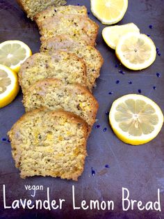 slices of lemon bread on a tray with sliced lemons