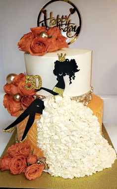 a white and orange wedding cake decorated with flowers