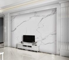 a living room with marble walls and flooring in white, grey and black colors