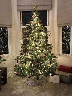 a decorated christmas tree in a living room