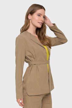 Introducing our Carmella Tan Belted Blazer, crafted in Italy from organic certified tencel fabric. With short lapels and an open-front silhouette, this blazer is versatile and perfect for any occasion. The long sleeves and buttoned waist belt create a flattering, tailored look. Complete the ensemble with our Andrea Tan Cropped pants and a bright top for a chic and stylish outfit. Handcrafted in Italy by Marisé Eco. Couture Composition: 64% Tencel, 22% Polyester, 12% Viscose, 2% Elastane Fit:Mode Tan Belt, Tencel Fabric, Belted Blazer, Feminine Silhouette, Waist Belt, Cropped Pants, Summer Collection, Clothing Store, Stylish Outfits