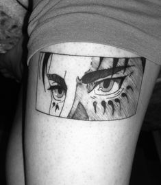 a person with a tattoo on their leg that has an image of a woman's face