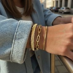 For your everyday wearable collection - our 14k gold-filled hammered bangles are made to put on and wear 24/7. Elevate your wrist stack with a set of bangles! *Handmade to order SIZING: To determine your perfect fit - close your hand in a 'cone shape' like you are putting on a bangle and measure the widest part of your hand by wrapping something around it and measuring against a ruler/tape measure. Choose size accordingly. When putting on a bangle you want it to be a little hard to put on so tha Bangle Stack, Wrist Stack, Hammered Bangles, Wrist Stacks, Gold Bangle Set, Bangle Bracelet Set, Elegant Attire, Hammered Gold, Gold Bangle