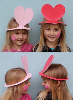 two girls wearing paper hats with hearts on them