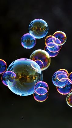 several soap bubbles floating in the air