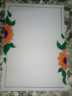 a white paper with orange and purple flowers painted on it's edges, sitting on a patterned table cloth