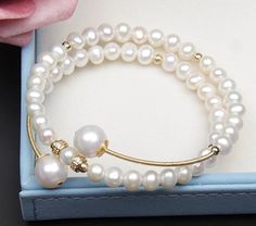 Beautiful Handmade Freshwater Pearl, Gold filled bead on a Brass wrapped bracelet.  Great for all occasions.  Bracelet can be adjusted to fit any size wrist. With a simple swirl of the coil you can make bracelet tighter or loosen for easier fit. Adjustable Single Strand Pearl Bracelet, Make Bracelet, Freshwater Pearl Bracelet, Delray Beach, Pearl Bracelet, Wrap Bracelet, Fresh Water, Freshwater Pearls, Gold Filled