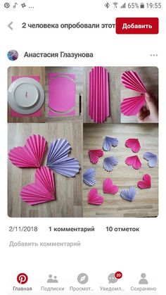 some pink and purple paper decorations on a table