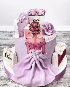 a cake decorated with pink and purple decorations