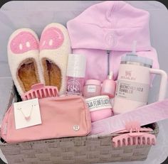 a basket filled with pink items including shoes, hairbrushes and other personal care products