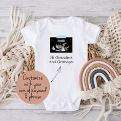 "This personalized baby outfit is a sweet way to announce your miracle on the way. Personalize it with your own ultrasound printed on, a phrase of your choice, and the color of the \"tape\" that holds the ultrasound up (blue, pink, or yellow). HOW TO ORDER: * Select the color and size you want and add the item to your cart * Enter your personalization: What phrase you want and what color \"tape\" holding up your ultrasound image - blue, pink, or yellow * After purchasing, send me a message with Personalized Fitted Onesie For Gender Reveal, Personalized White Onesie For Father's Day, Customizable White Onesie For Gender Reveal, Customizable Fitted Onesie As Gift, Gift Custom Print Short Sleeve Onesie, Personalized White Onesie As A Gift, Customizable White Onesie As A Gift, Personalized White Onesie As Gift, Customizable White Onesie As Gift