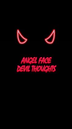 the words angel face devil thoughts glowing in the dark with red eyes and fangs on it