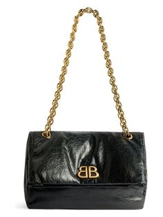 This adorable small Monaco bag in black arena calfskin with antique-gold hardware is the perfect accessory for any occasion. With a chain shoulder strap, magnetic flap closure, and multiple interior pockets, it's as practical as it is stylish. Chain shoulder strap Monaco BB logo on the front Magnetic flap closure One pocket under the flap One main interior compartment One interior flat pocket Dimensions: 27.9x18x9.9cm Size nationality: UNI Bb Logo, Black Balenciaga, Shoulder Chain, Black Shoulder Bag, Chain Bag, Hobo Handbags, Chain Shoulder Bag, Leather Items, Chain Bags