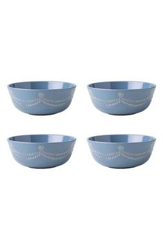 four blue bowls sitting next to each other