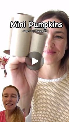 a woman holding two cups in front of her face with the words mini pumpkins on it