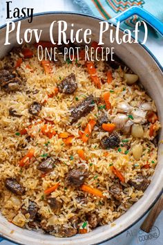 a pot filled with rice and vegetables on top of a table