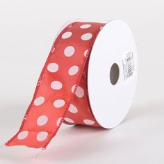 a roll of red and white polka dot ribbon